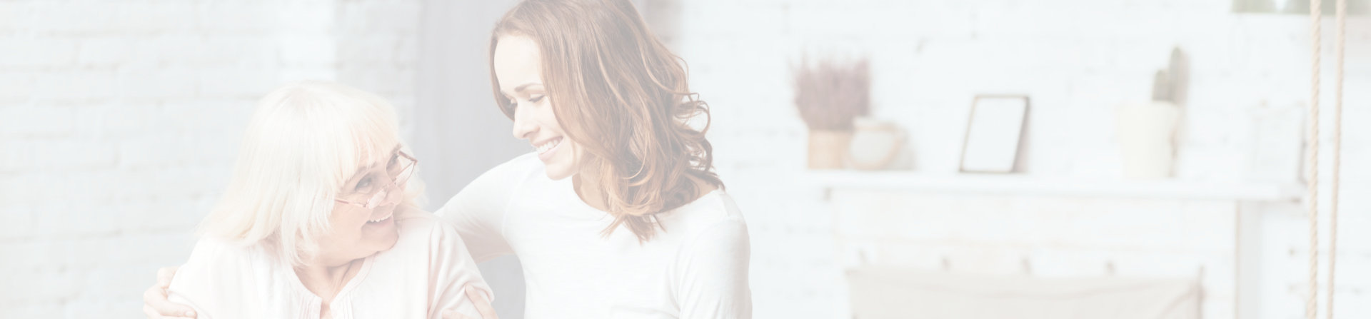 smiling old woman and caregiver