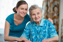 elderly woman with her caregiver